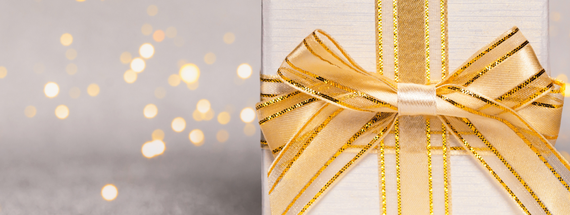 Gold lights with gold present on gray background