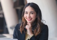 Young business woman sitting at computer