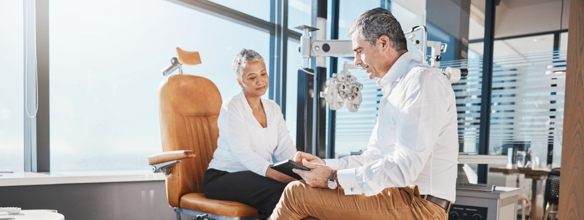 Eye doctor talking to patient